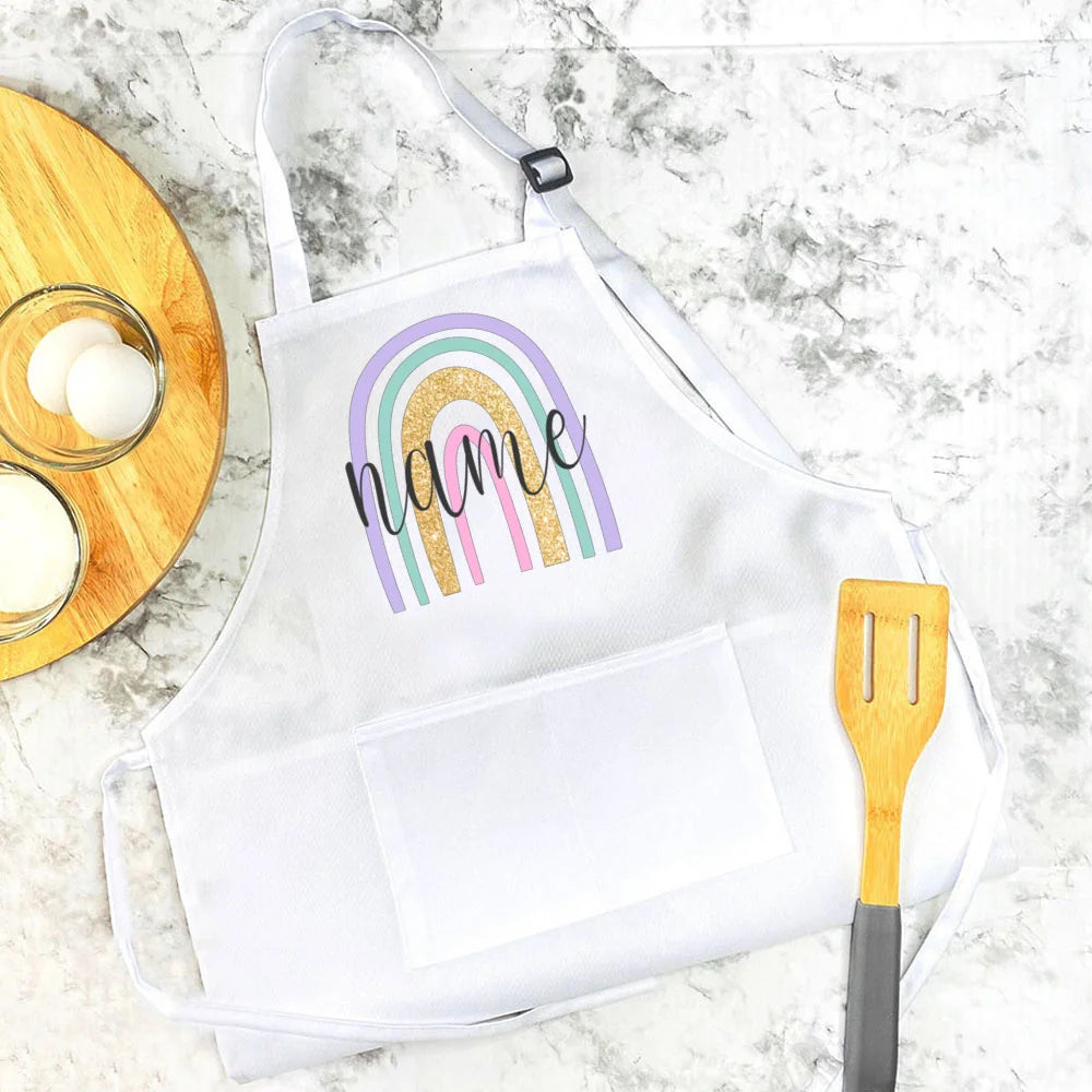 Personalisierte Kinderschürze mit Regenbogen-Motiven